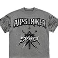 Gray t-shirt with 'AIP STRIKER' logo featuring a stylized character and crossed swords on a white background.